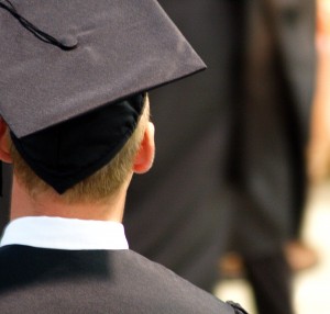 Student wearing graduation cap from behind